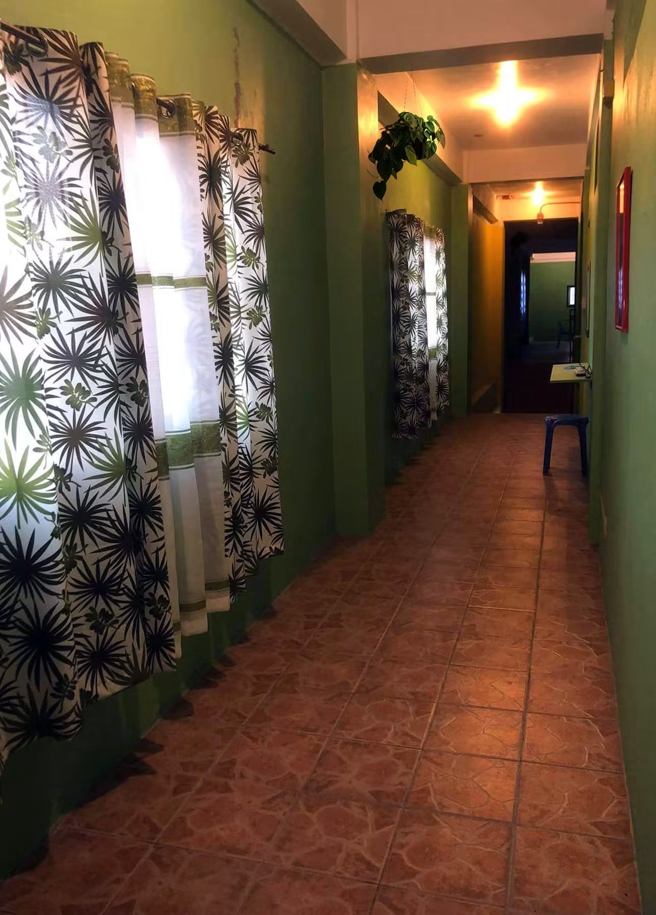 The hallway, lit and quiet after curfew.