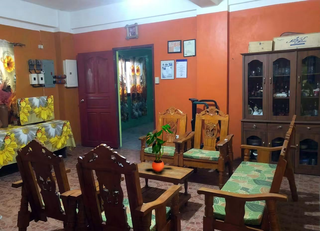 The house living room – permits on the wall, nothing hidden.